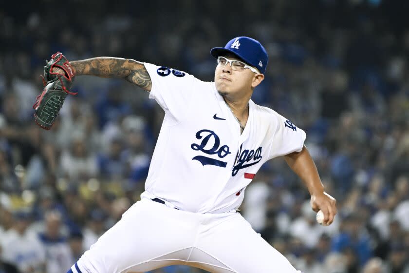 Los Angeles, CA - October 11: Los Angeles Dodgers starting pitcher Julio Urias (7) delivers a pitch.