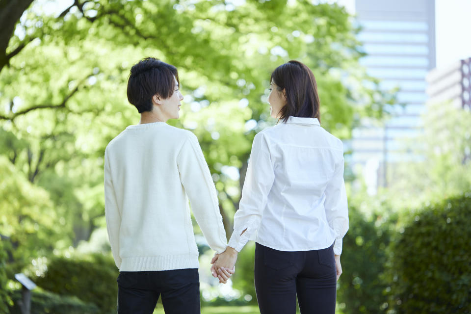 Hands of a couple holding hands