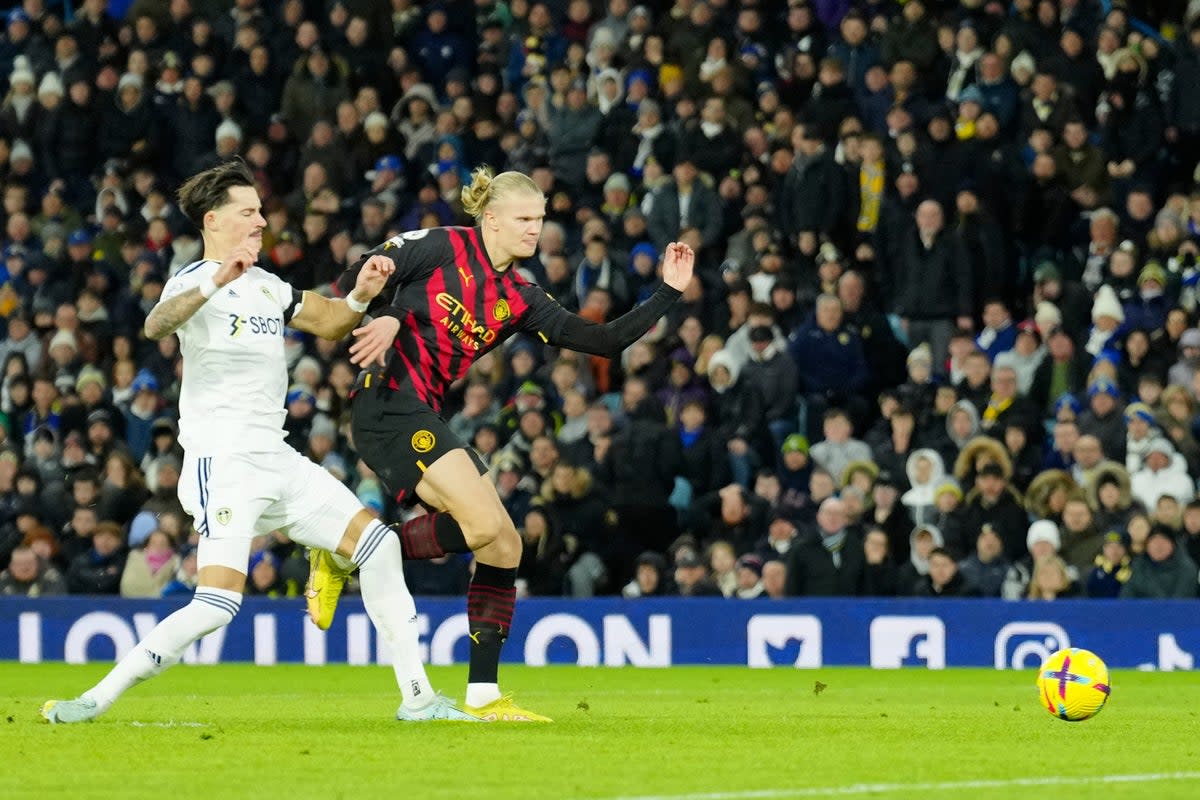 Erling Haaland slots home Manchester City’s second goal at Leeds (AP)