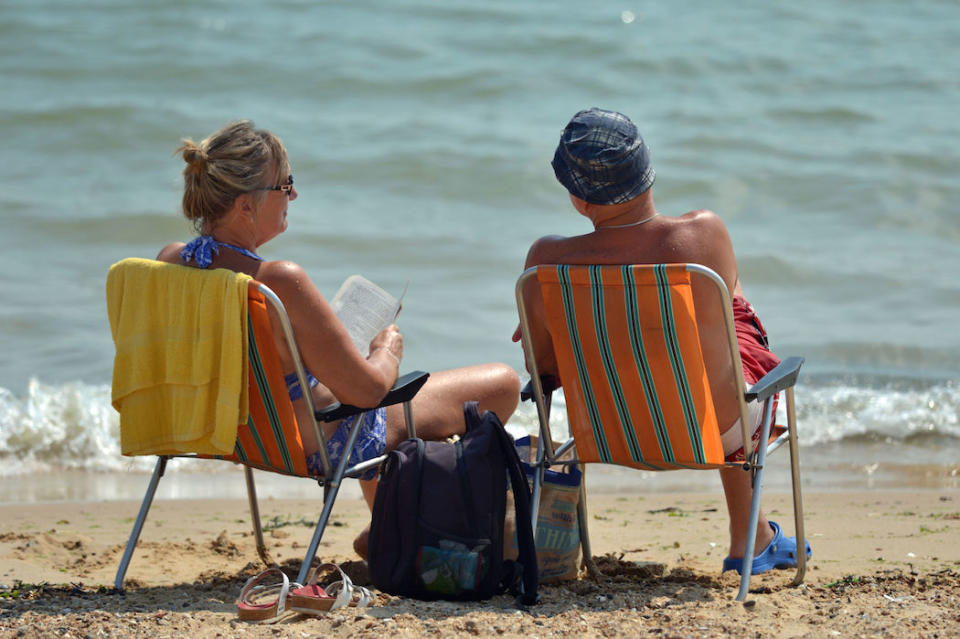 A couple enjoy the hot weather on the beach at Clacton-on-Sea in Essex last Friday (Picture: PA)