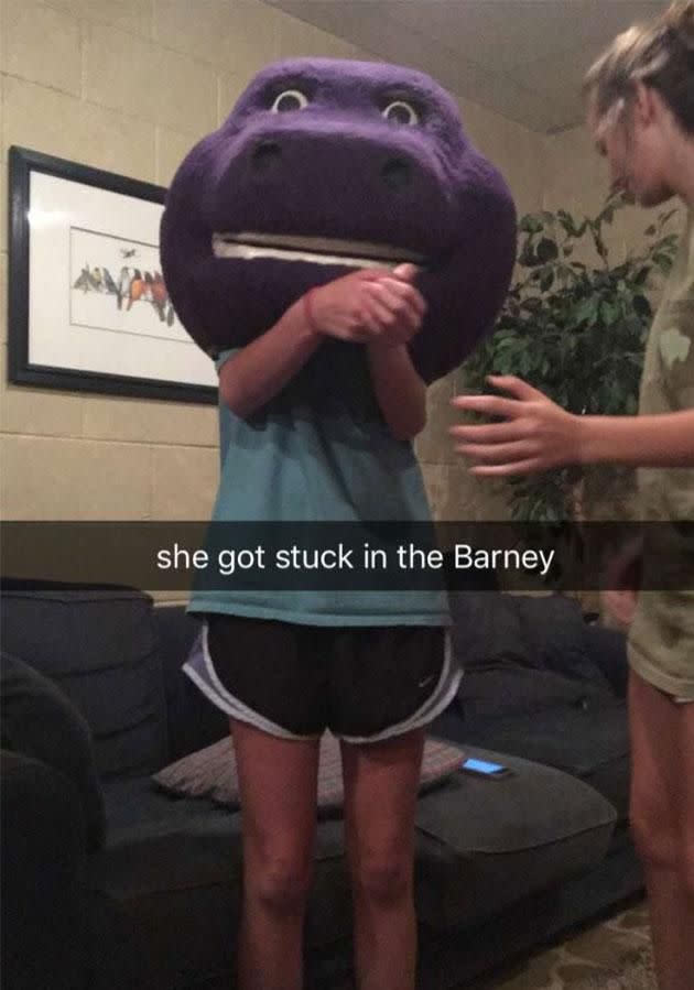 Firefighters had to save her from being trapped inside the giant Barney head. Photo: Twitter