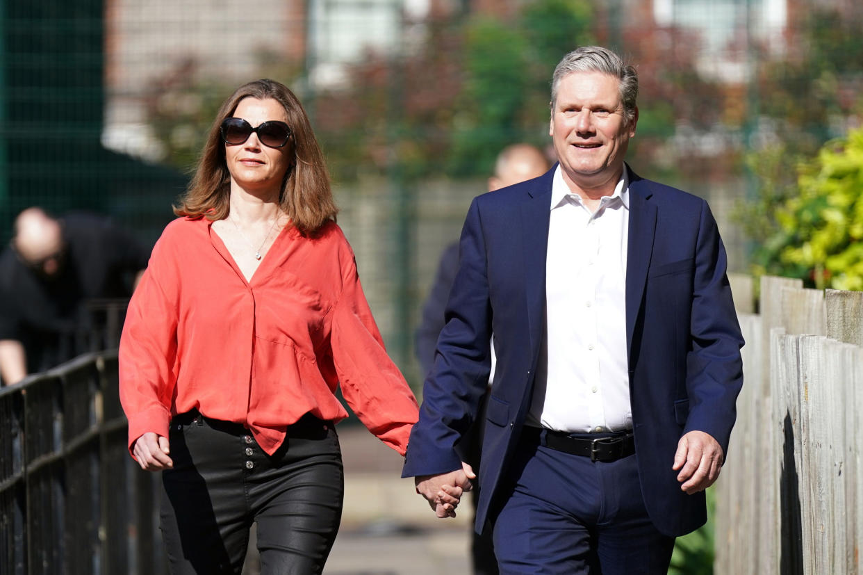 Labour leader Keir Starmer and his wife Victoria arrive to vote at the TRA Hall, London, Thursday May 5, 2022. People in Britain are voting in local elections that will decide the makeup of local authorities across the country — and possibly the fate of embattled Prime Minister Boris Johnson. (Aaron Chown/PA Wire/PA via AP)