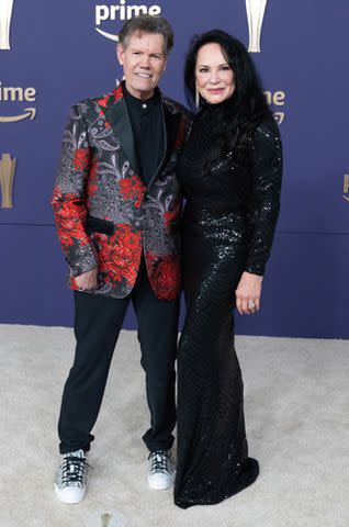 <p>SUZANNE CORDEIRO/AFP via Getty</p> Randy and Mary Travis