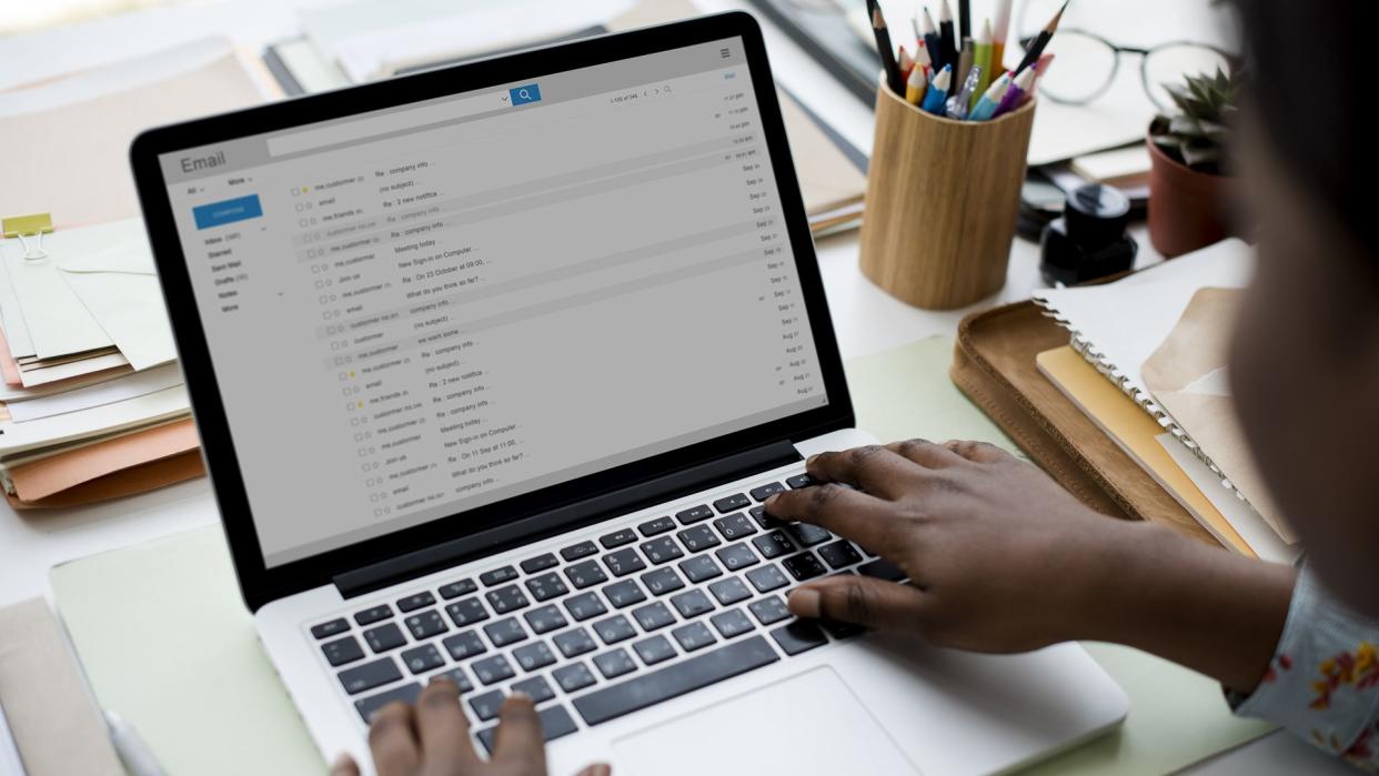 woman using email on laptop