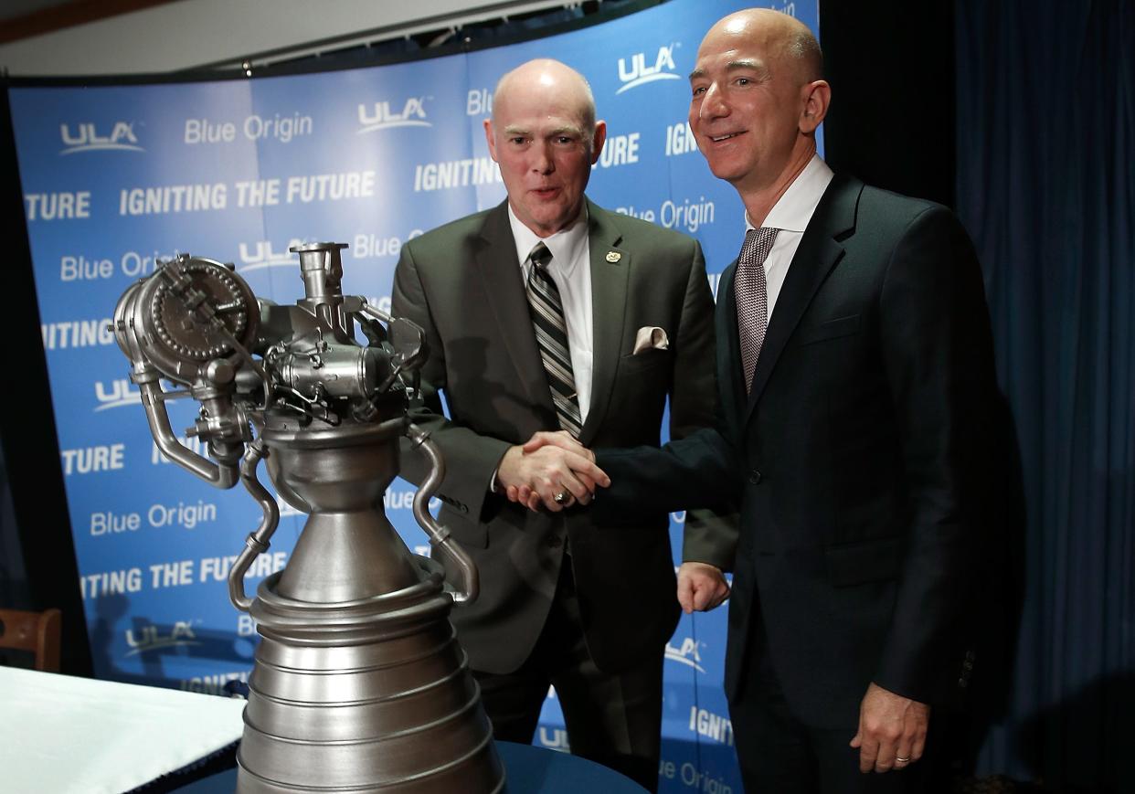 Jeff Bezos shakes hands with ULA CEO Tory Bruno