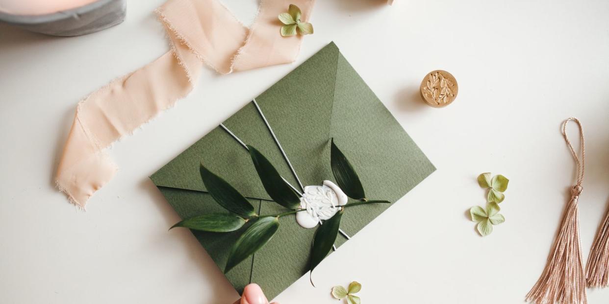 green modern recycled paper wedding invitation on white background