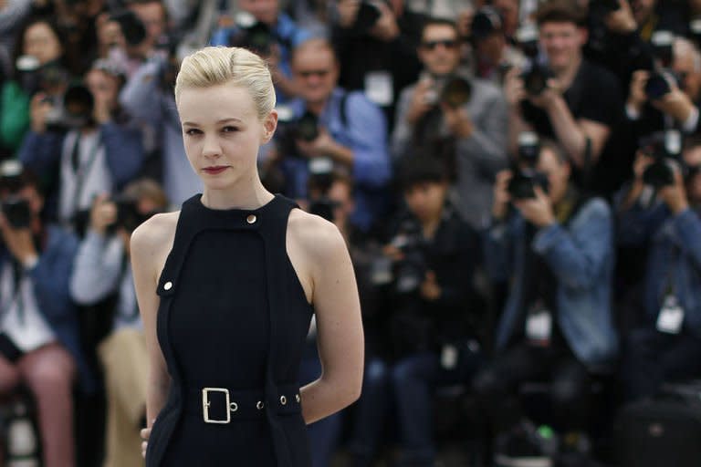 British actress Carey Mulligan poses on May 19, 2013 during a photocall for the film "Inside Llewyn Davis" at the Cannes Film Festival. The "Great Gatsby" actress Mulligan traded in her Tiffany jewellery and Prada-designed flapper dresses for polo necks and duffel coats in her second star turn at the festival in the Coen brothers' eagerly anticipated film