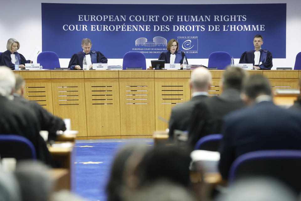 European Court of Human Rights president Siofra O'Leary, second right, chairs the Grand Chamber Wednesday, March 29, 2023 in Strasbourg, eastern France. A group of Swiss seniors are taking their government to the European Court of Human Rights to demand more action on climate change which, they say, is seriously affecting their lives. (AP Photo/Jean-Francois Badias)