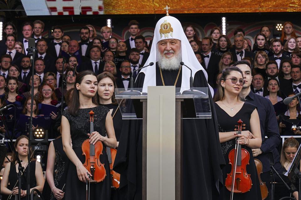 FILE - In this handout photo released by Russian Orthodox Church Press Service, Patriarch Kirill, center, speaks before a concert celebrating the Day of Slavic Literature and Culture in Red Square in Moscow, Russia on May 24, 2023. Over three decades, Russia has gone from having some of the world's least-restrictive abortion laws to being what officials call a bulwark of “traditional values,” with the health minister condemning women for prioritizing careers over childbearing. (Sergey Vlasov, Russian Orthodox Church Press Service via AP, File)