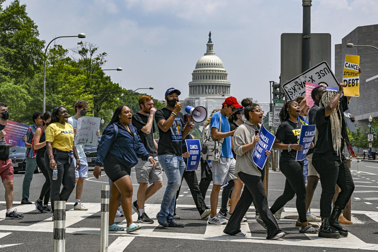 Demonstrators in favor of cancelling student debt march from the Supreme Court to the White House in Washington, June 30, 2023. (Kenny Holston/The New York Times)