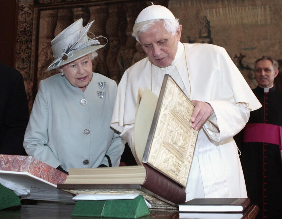Queen Elizabeth II talking with Pope Benedict XVI during an audience in the Morning Drawing Room at the Palace of Holyroodhouse in Edinburgh during a four day visit by the Pope to the UK, 2010 (AFP/Getty)