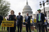 Sen. Tina Smith, D-Minn., left, speaks about climate change, accompanied by Sen. Ed Markey, D-Mass., Sen. Chris Van Hollen, D-Md., and Sen. Ron Wyden, D-Ore., during a news conference on Capitol Hill, Thursday, Oct. 7, 2021, in Washington. (AP Photo/Alex Brandon)