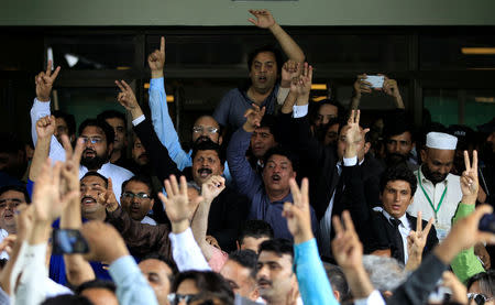 Opponents of Prime Minister Nawaz Sharif shout slogans as they exit the Supreme Court in Islamabad, Pakistan July 28, 2017. REUTERS/Caren Firouz