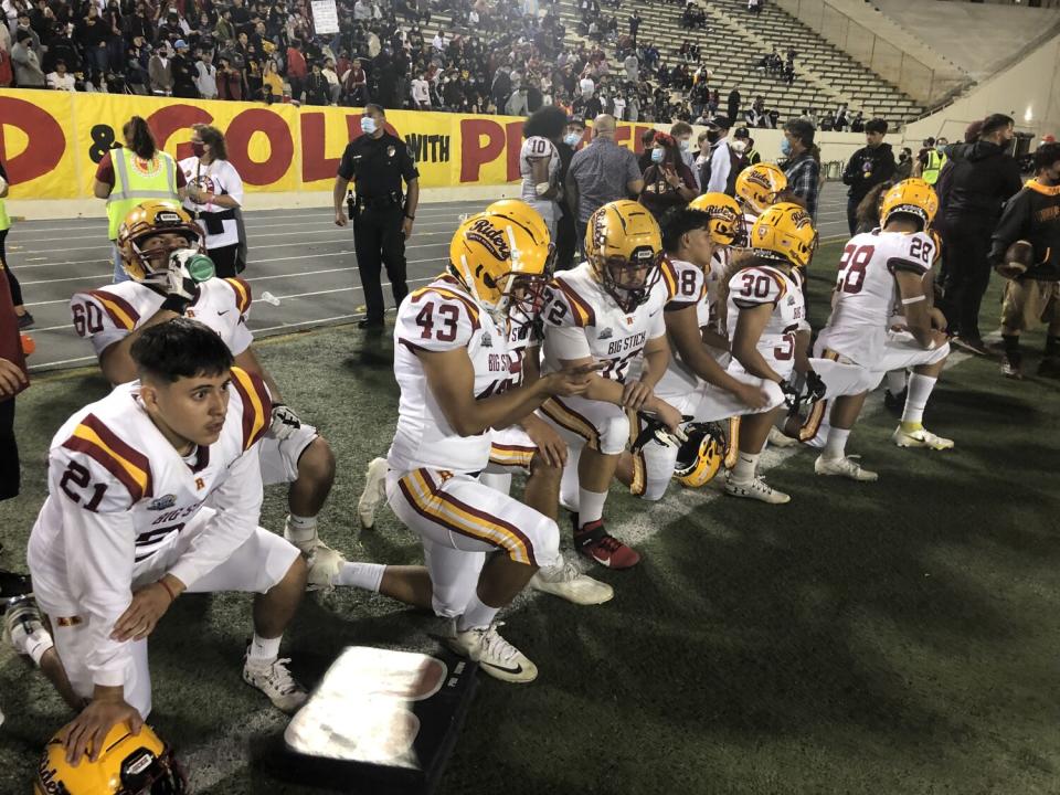 Roosevelt players look on from the sideline during the East L.A. Classic last year.