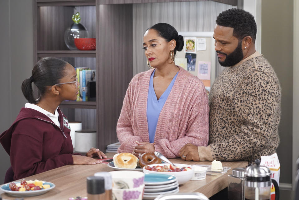 This image released by ABC shows Marsai Martin, from left, Tracee Ellis Ross and Anthony Anderson in a scene from "black-ish." In the episode airing on Tuesday, Jan. 15, Dre, played by Anderson, and Bow, played by Ross, are furious after Diane, played by Martin, isn't lit properly in her class photo. The episode outlines the history of colorism in depth while injecting some humor. (Ron Tom/ABC via AP)