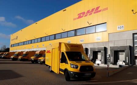 FILE PHOTO: An electric powered truck of German postal and logistics group Deutsche Post DHL is pictured at a parcels distribution centre in Berlin