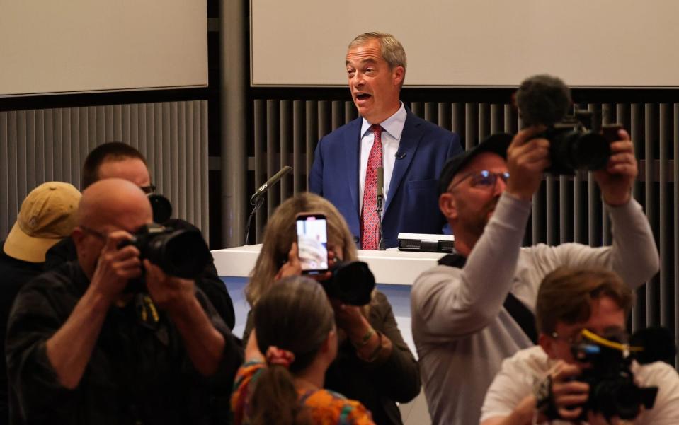 Nigel Farage speaks as media focus on hecklers