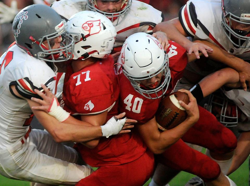 Loudonville High School's Baylor Weiser (40) powers through with blocking by Loudonville High School's Zane Rossey (77)during football action between Centerburg and Loudonville at Redbird Stadium  Friday September 16,2022  Steve Stokes/for Ashland Times-Gazette