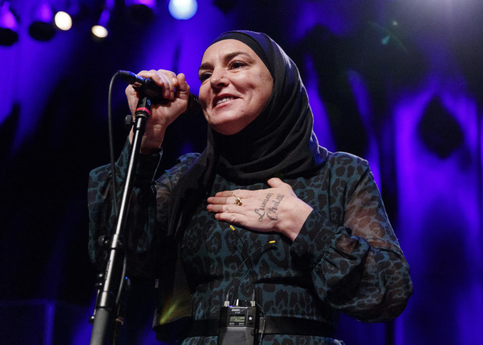 Sinead O'Connor performing on stage