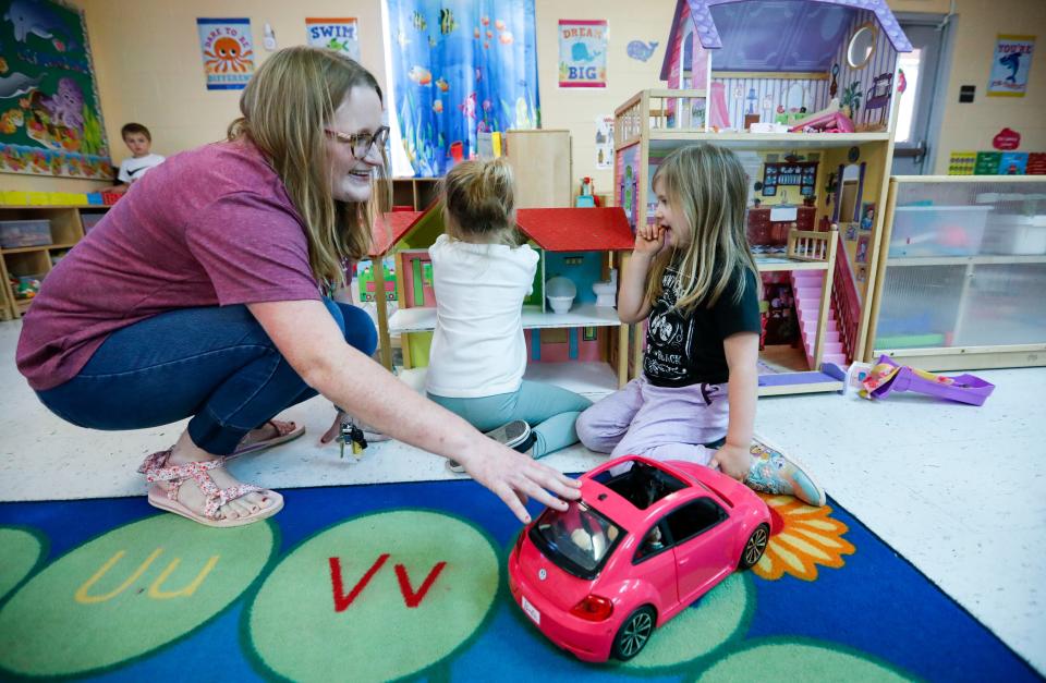 Humansville preschool teacher Savannah Hammond interacts with students Allyson (right) and Whitlee during play time on Wednesday, Nov. 15, 2023.