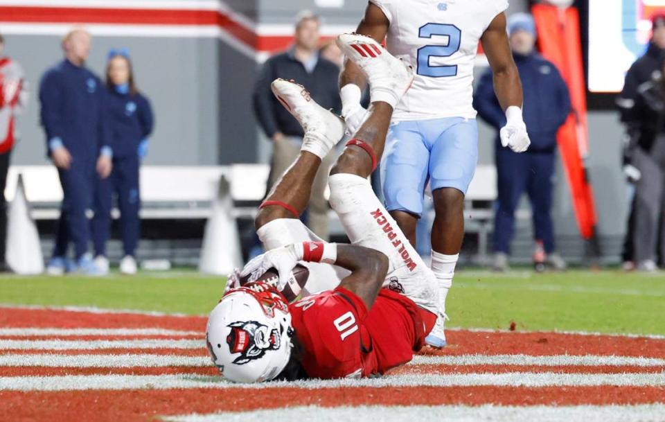 N.C. State wide receiver KC Concepcion (10) pulls in a 11-yard touchdown reception during the first half of N.C. State’s game against UNC at Carter-Finley Stadium in Raleigh, N.C., Saturday, Nov. 25, 2023.