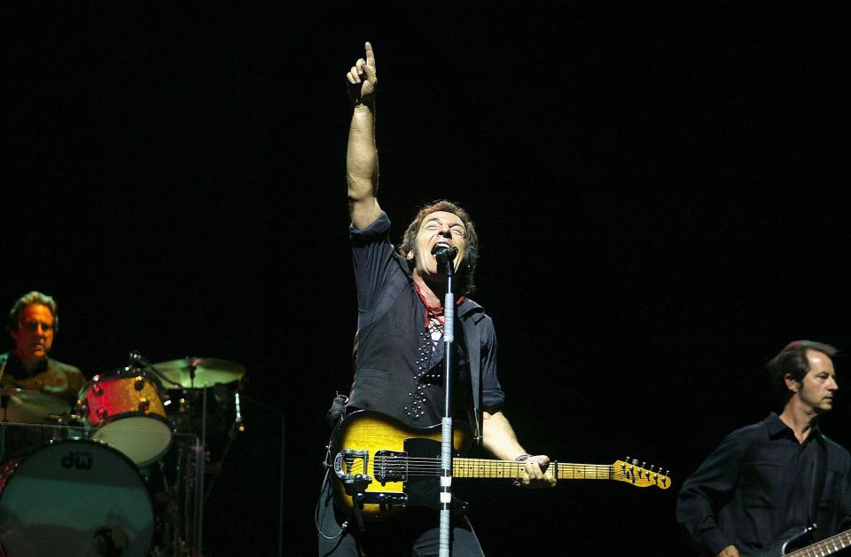 Bruce Springsteen and the E Street Band perform on stage at Giants Stadium on July 21, 2003 in East Rutherford, New Jersey.