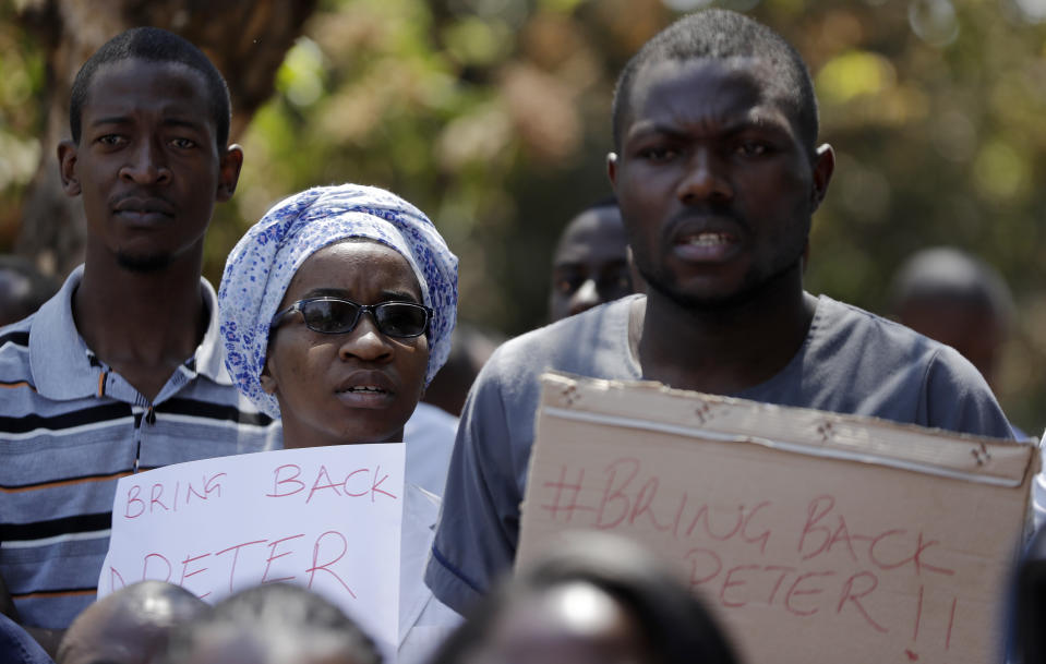 A group of Zimbabwean doctors protest at Parirenyatwa hospital in Harare, Zimbabwe, Sunday, Sept. 15, 2019. The Zimbabwe Hospital Doctors Association, which represents hundreds of junior doctors countrywide, said the association's president Peter Magombeyi was abducted on Saturday, days after receiving threats on his phone. (AP Photo/Themba Hadebe)