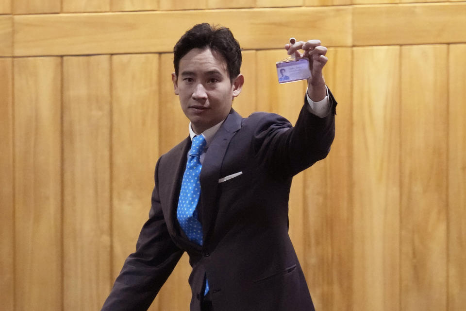 FILE - Pita Limjaroenrat, the leader of Move Forward Party and top winner in the May's general election shows the lawmaker ID during a meeting at Parliament in Bangkok, Thailand, on July 19, 2023. Eight months ago, Pita shook up Thai politics by leading his progressive party to a stunning first-place finish in the 2023 general election, putting him in a good position to be named the country’s next prime minister. But Pita's fortune changed. Now he’s fighting an uphill battle just to retain his seat in Parliament, from which he has already been suspended. (AP Photo/Sakchai Lalit, File)