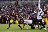 FILE PHOTO: Aug 30, 2018; Baltimore, MD, USA; Washington Redskins running back Rob Kelley (20) runs past Baltimore Ravens defensive end Christian LaCouture (91) during the second quarter at M&T Bank Stadium. Mandatory Credit: Tommy Gilligan-USA TODAY Sports/File Photo