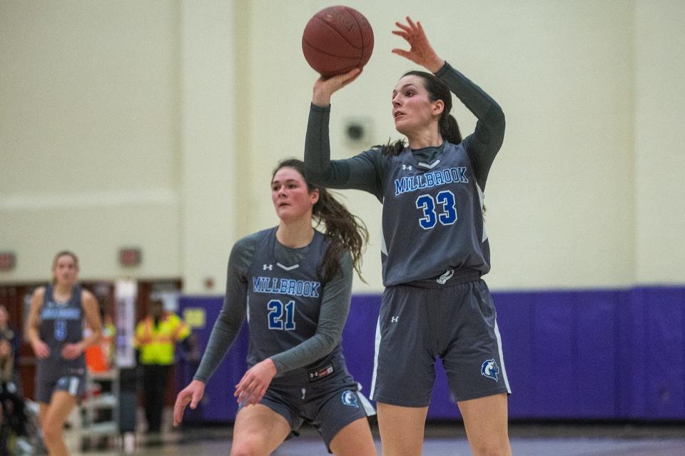Millbrook's Emily Grasseler shoots during a Coaches vs. Cancer game against Pine Bush in January. Grasseler scored 16 points as Millbrook beat Port Jefferson in the state Class D regional final.