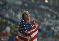 Deanna Price, of the United States, celebrates after winning the gold in the women's hammer final at the World Athletics Championships in Doha, Qatar, Saturday, Sept. 28, 2019. (AP Photo/Petr David Josek)