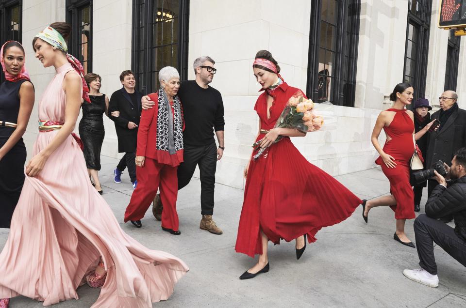 “Everybody has rallied around me,” Maxwell says of his loved ones from New York, his home state of Texas, and beyond. “It’s such a special thing.”
Maxwell (center, in black sweater) surrounded by model friends, along with his mother, Pam Woolley (left, in black dress, on the arm of Maxwell’s fiancé, Jessy Price), and grandmother Louise Johnson (in red suit) in Manhattan.