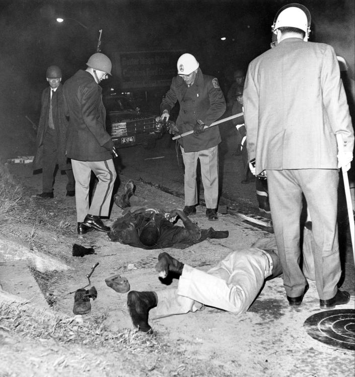 FILE - This file photo shows two black people killed in the "Orangeburg Massacre" at the edge of South Carolina State College in Orangeburg, S.C., on Thursday, Feb. 8, 1968. The killings are among the cases under review by the Justice Department's Cold Case Initiative, according to the agency's latest report to Congress. (AP Photo/File)