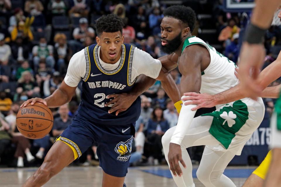 Apr 10, 2022; Memphis, Tennessee, USA; Memphis Grizzlies guard Jarrett Culver (23) drives to the basket as Boston Celtics guard  Jaylen Brown (7) defends during the first half at FedExForum.