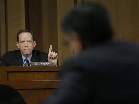 U.S. Senator Pat Toomey (R-PA) questions U.S. Treasury Secretary Jack Lew (foreground) at the Senate Finance Committee on the U.S. government debt limit in Washington October 10, 2013. REUTERS/Gary Cameron