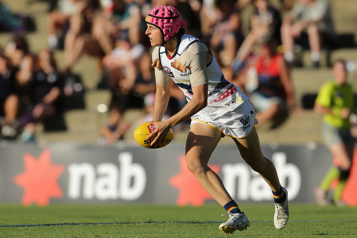 FREMANTLE, WESTERN AUSTRALIA - FEBRUARY 26: Heather Anderson of the Crows looks to pass the ball during the round four AFL Women&#39;s match between the Fremantle Dockers and the Adelaide Crows at Fremantle Oval on February 26, 2017 in Fremantle, Australia.  (Photo by Will Russell/AFL Media/Getty Images)