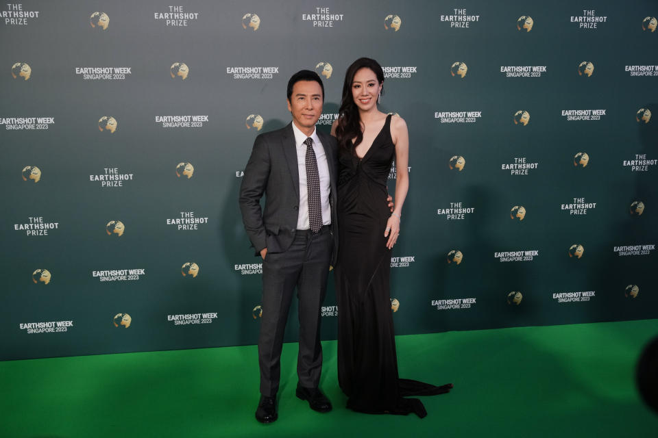 Hong Kong's actor Donnie Yen and his wife Cissy Wang pose on the green carpet for the 2023 Earthshot Prize Awards in in Singapore, Tuesday, Nov. 7, 2023. (AP Photo/Vincent Thian)