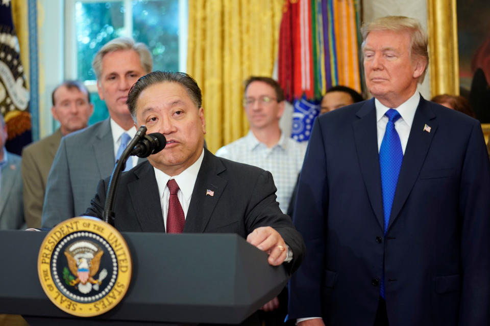 Hock E. Tan, CEO of Broadcom, speaks after U.S. President Donald Trump delivered remarks about the situation of the job market, in the Oval Office of the White House in Washington, U.S. November 2, 2017. REUTERS/Carlos Barria