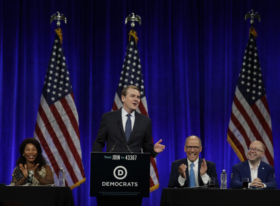 Democratic presidential candidate Sen. Michael Bennet, D-Colo., gestures while speaking at the Democratic National Committee's summer meeting Friday, Aug. 23, 2019, in San Francisco. More than a dozen Democratic presidential hopefuls are making their way to California to curry favor with national party activists from around country. Democratic National Committee members will hear Friday from top contenders, including Elizabeth Warren, Kamala Harris and Bernie Sanders. (AP Photo/Ben Margot)