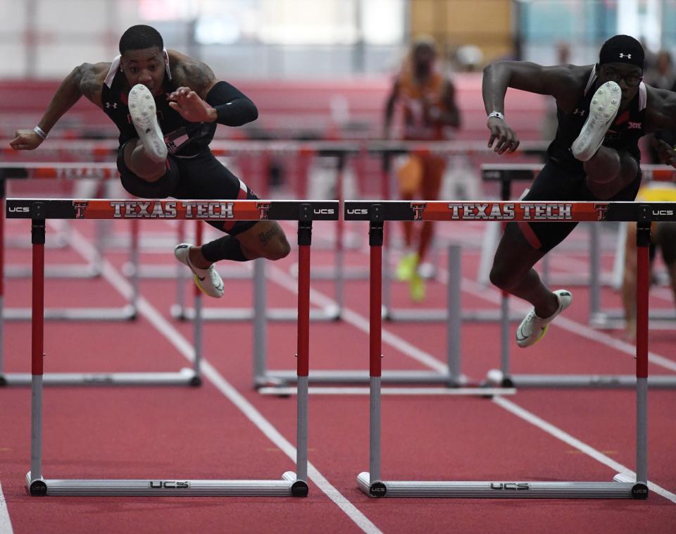 Texas Tech's Caleb Dean, left, and Antoine Andrews compete in the 60-meter hurdles final at the Big 12 indoor track and field championships. Dean and Andrews finished first and second and the Red Raiders had five of the top six finishers.