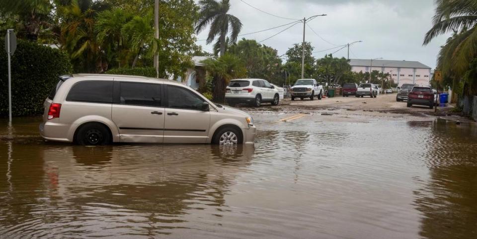 A stranded vehicle sits in floodwaters on Flagler Avenue in Key West, Florida, on Sept. 28, 2022. Hurricane Ian brushed Key West on its way to the mainland, leaving flooded streets due to rain and storm surge.