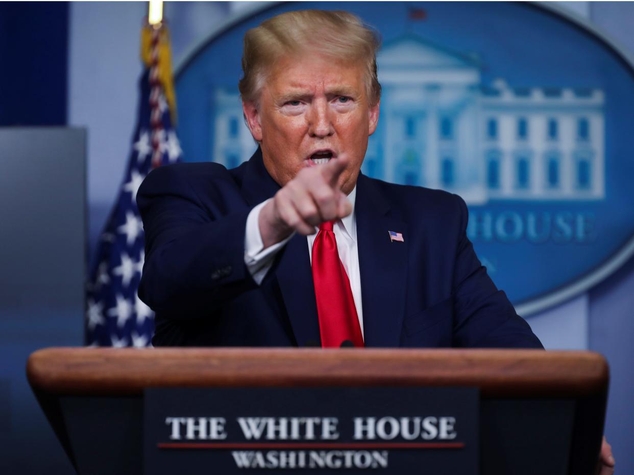 U.S. President Donald Trump points to a reporter as he answers questions during the daily coronavirus task force briefing at the White House in Washington, U.S., April 20, 2020. REUTERS/Jonathan Ernstâ€¨