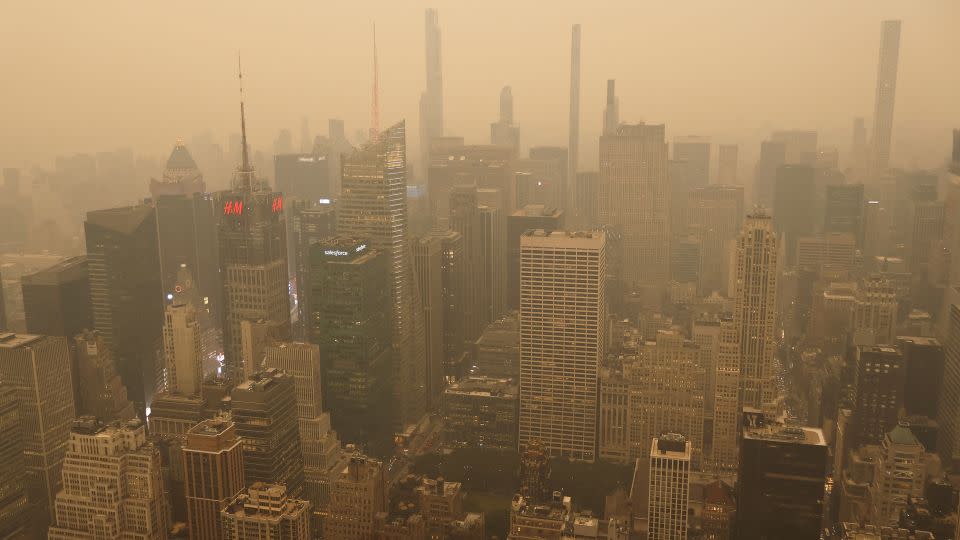 Heavy smoke shrouds buildings around Times Square in New York City on Tuesday. - Gary Hershorn/Corbis News/Getty Images