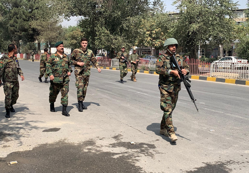 Afghan army soldiers arrive at the site of a car bomb blast in Kabul, Afghanistan, Thursday, Sept. 5, 2019. A large car bomb rocked the Afghan capital on Thursday and smoke rose from a part of eastern Kabul near a neighborhood housing the U.S. Embassy, the NATO Resolute Support mission and other diplomatic missions. (AP Photo/Rahmat Gul)