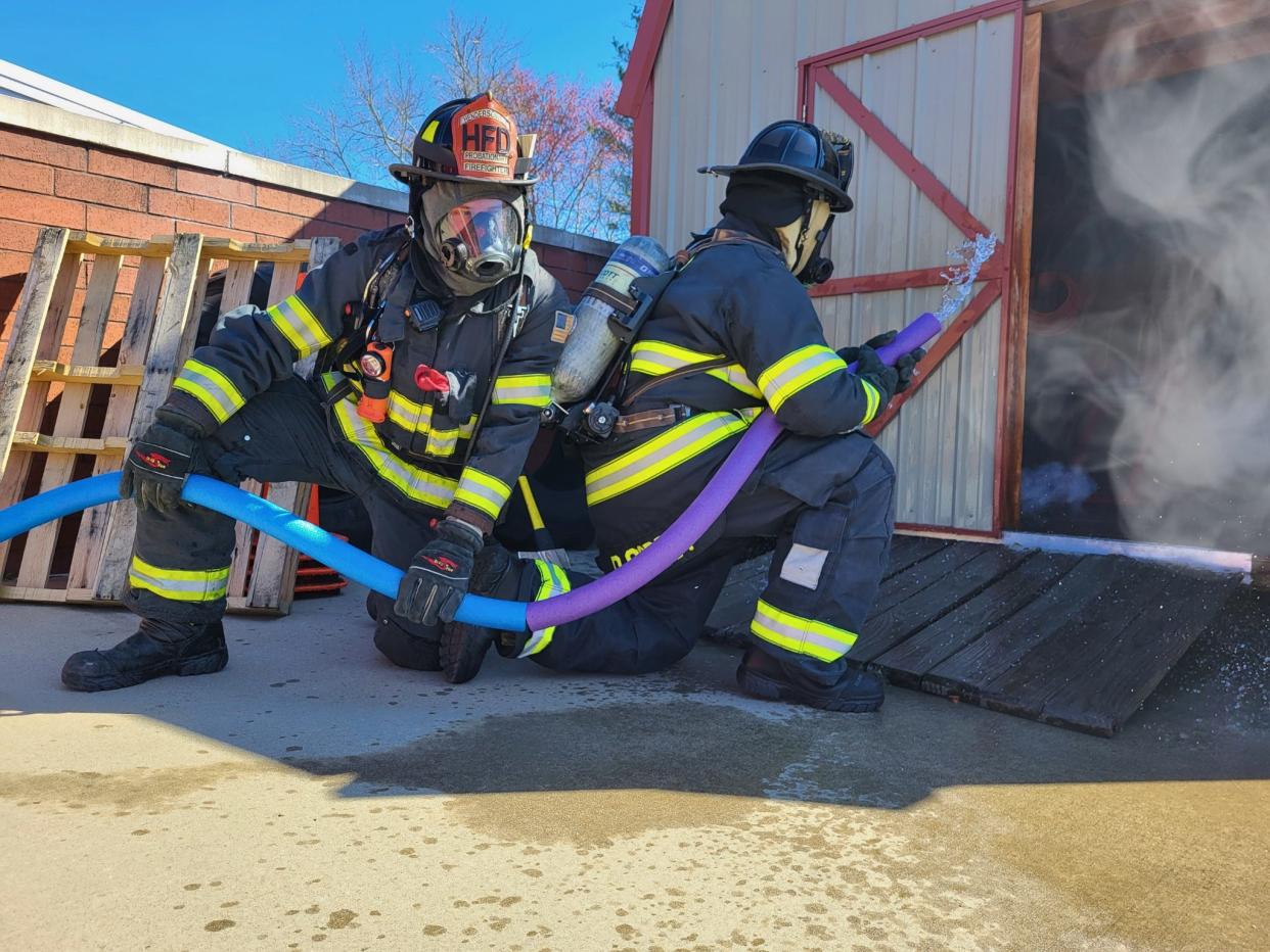 Hendersonville firefighters pretend they are fighting a fire with pool noodles in an April Fool's social media post on April 1, 2023. The post was the idea of Brandy Heatherly, who won "Best Use of Humor" at the NC3C communicators conference in Concord.