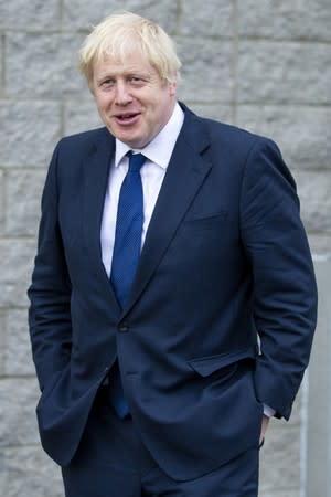 Britain's Prime Minister Boris Johnson leaves after visiting Peterhead Fish Market in Peterhead