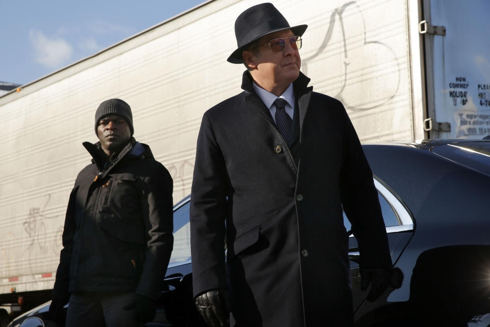 Hisham Tawfiq and james Spader stand outside a car