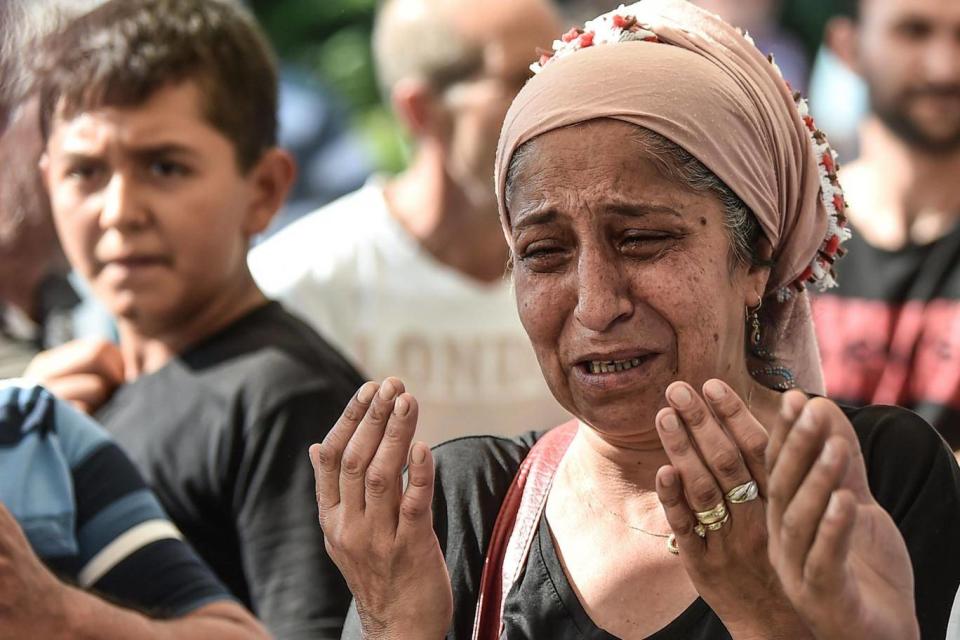 A relative of Ayse Basaran, a victim of the train accident, mourns during a funeral ceremony (AFP/Getty)