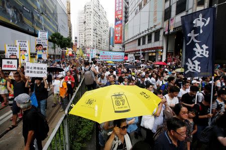 Protesters take part in a march in Hong Kong, China, July 1, 2018, to mark the 21st anniversary of the city's handover to Chinese sovereignty from British rule. REUTERS/Bobby Yip