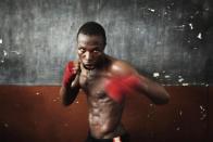 Olympic hopeful Abdul Rashid Bangura, 27, shadow boxes while training at the national stadium in Sierra Leone's capital Freetown, April 25, 2012. Sierra Leone's national boxing team was scrambling on Wednesday to raise money to send athletes to an Olympic qualifying event starting in Morocco on Friday, but lack of financing and government support means the competition is likely out of reach for most of the national team.